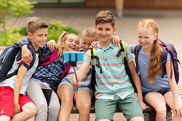 Image showing happy elementary school students taking selfie