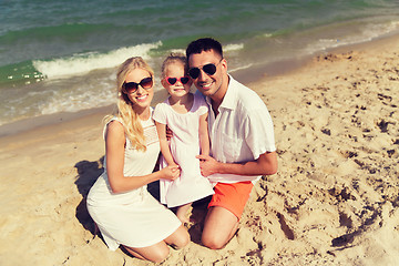 Image showing happy family in sunglasses on summer beach