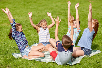 Image showing group of happy kids or friends outdoors