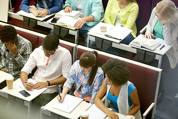 Image showing group of students with notebooks at lecture hall