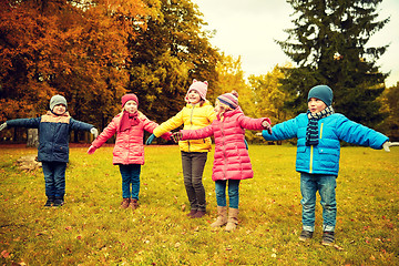 Image showing happy little children running and playing outdoors