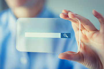 Image showing close up of woman with transparent smartphone