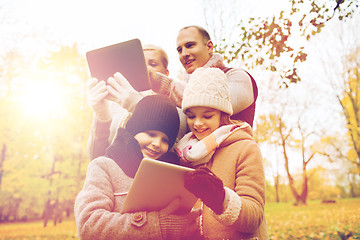 Image showing happy family with tablet pc in autumn park