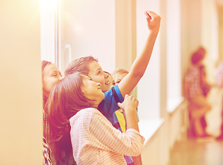 Image showing group of school kids taking selfie with smartphone