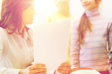 Image showing close up of school kids with teacher in classroom