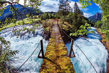 Image showing Suspension bridge over the mountain river, Norway.