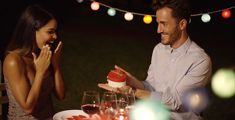 Image showing Romantic young man presenting a Valentines gift