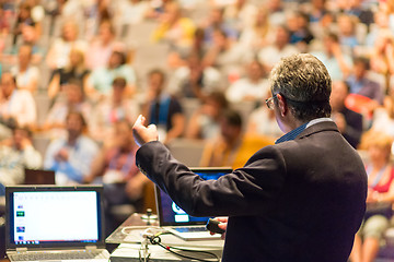 Image showing Public speaker giving talk at Business Event.