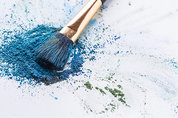 Image showing Crisp blue eye shadow with brush on white background