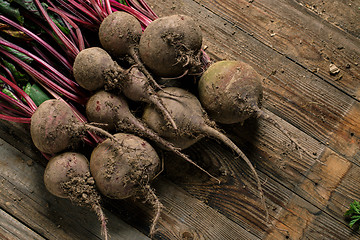 Image showing Young beets on wooden table