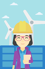 Image showing Female worker of solar power plant and wind farm.