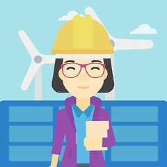 Image showing Female worker of solar power plant and wind farm.