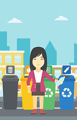 Image showing Woman throwing away plastic bottle.