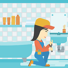 Image showing Woman repairing sink.