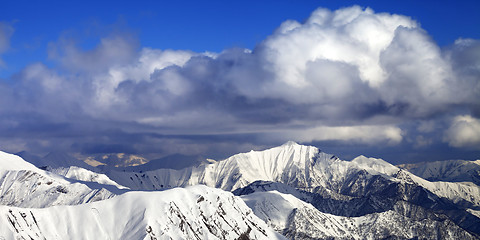 Image showing Panoramic view on snowy ridges in sun winter day
