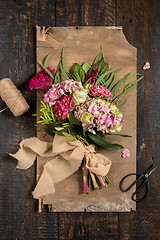 Image showing The flowers on wooden background