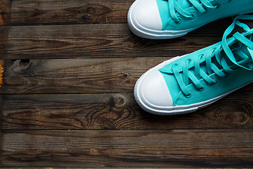 Image showing blue shoes on wooden floor