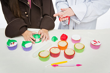 Image showing Closeup of funny christmas cupcakes