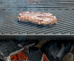 Image showing beef steaks on the grill