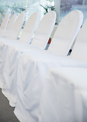 Image showing chairs with white fabric cover for celebrations