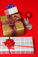 Image showing christmas presents on red