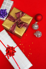 Image showing christmas presents on red