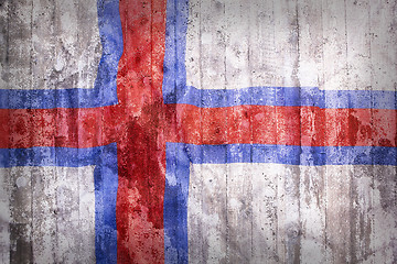 Image showing Grunge style of Faroe Islands flag on a brick wall