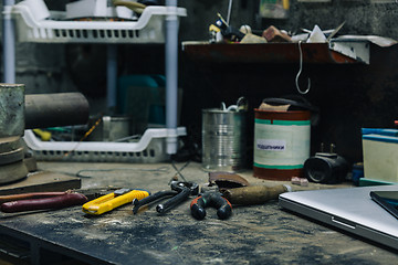 Image showing Top view of old tools,laptop and phone on table