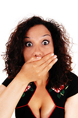 Image showing Shocked woman with hand over mouth.