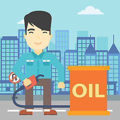 Image showing Man with oil barrel and gas pump nozzle.