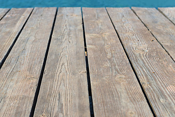 Image showing Empty top of wooden background and view to the sea