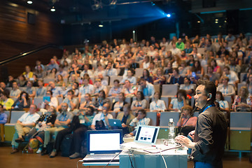 Image showing Public speaker giving talk at Business Event.