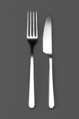 Image showing Fork and knife on grey