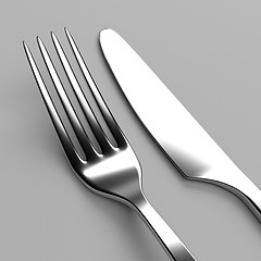 Image showing Fork and knife on grey
