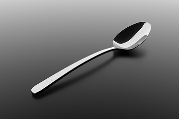 Image showing Silver spoon on a table