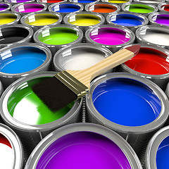 Image showing Multiple open paint cans with a brush. 