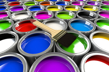 Image showing Multiple open paint cans with a brush. 