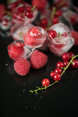 Image showing Frozen berries on wooden table