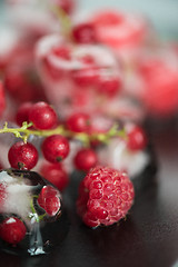 Image showing Frozen berries on wooden table