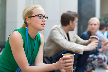 Image showing Cheerful colleagues meeting for coffee break.