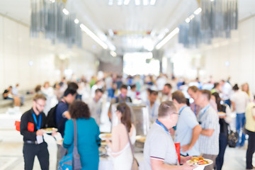 Image showing Abstract blurred people socializing during lunch break at business conference.