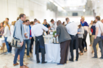 Image showing Abstract blurred people socializing during coffee break at business conference.