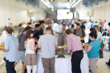 Image showing Abstract blurred people socializing during lunch break at business conference.