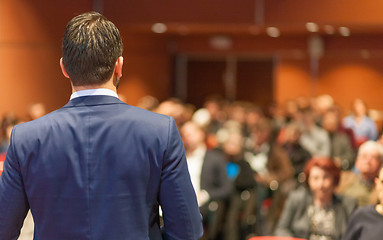 Image showing Public speaker giving talk at Business Event.