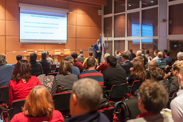 Image showing Business speaker giving a talk in conference hall.