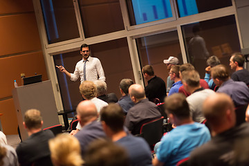 Image showing Business speaker giving a talk in conference hall.