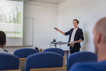 Image showing Student presenting his study work in front of whiteboard.