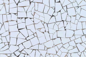 Image showing White broken tiles wall