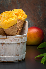 Image showing Homemade mango ice cream in waffle cone