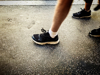 Image showing People walking on a walkside